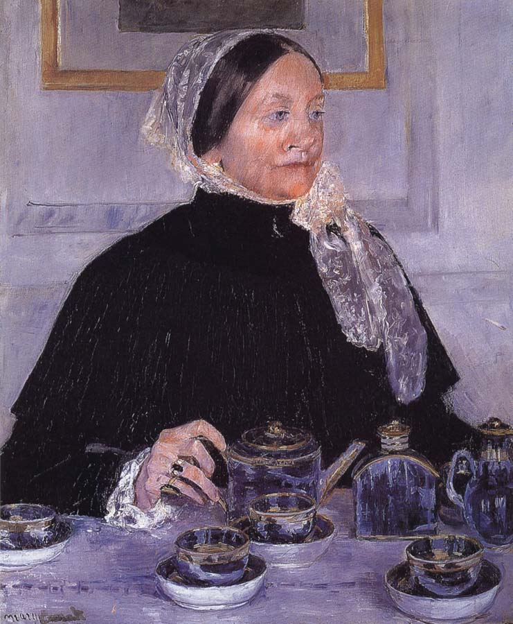 Woman beside tea-table